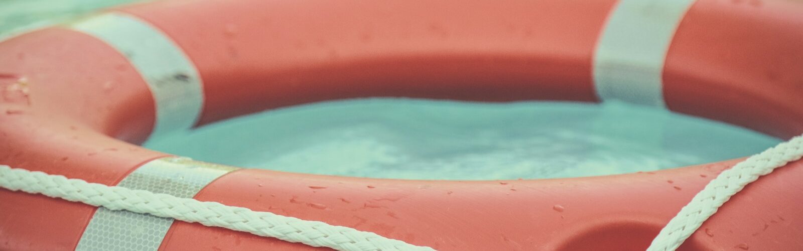 red and white lifebuoy